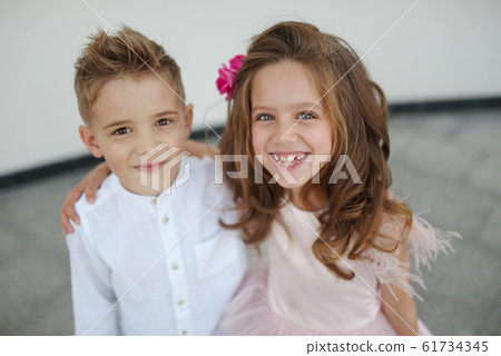 young happy boy and girl together outside 61734345