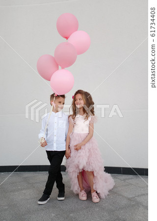 young happy boy and girl together outside young happy boy and girl together outside 61734408