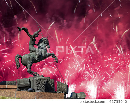 Fireworks over the Monument to Saint George slaying a dragon on Poklonnaya hill in Victory Park,Moscow,Russia 61735940