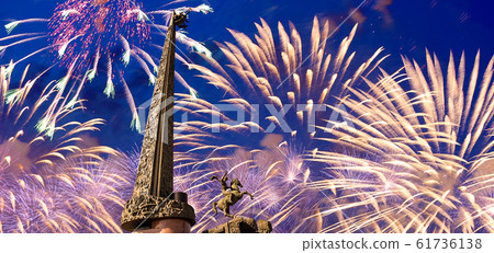 Fireworks over the War memorial in Victory Park on Poklonnaya Hill (Gora), Moscow, Russia. Fireworks over the War memorial in Victory Park on Poklonnaya Hill (Gora), Moscow, Russia. 61736138