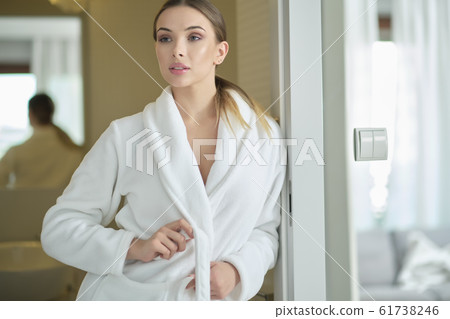 woman in a dressing gow at home 61738246