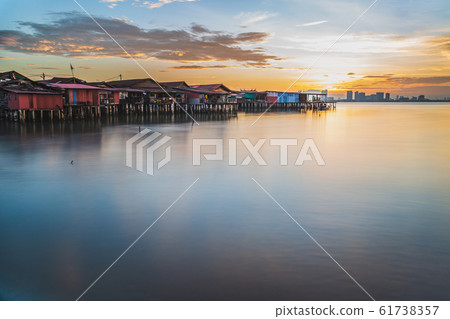 Chew jetty fisherman village in George Town Penang Malaysia at sunrise. Chew jetty fisherman village in George Town Penang Malaysia at sunrise. 61738357