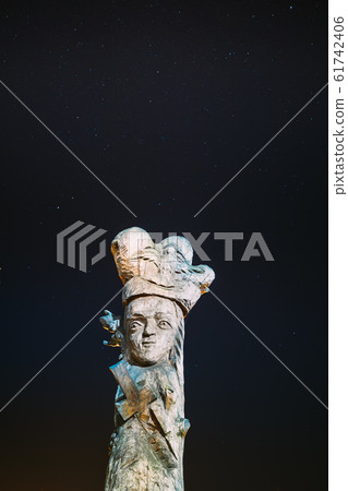 Ruzhany, Brest Region, Belarus. Starry Sky Above Wooden Sculptures Figures Of Belarusian Historical Characters In Autumn Night. Landmark Under Night Stars 61742406