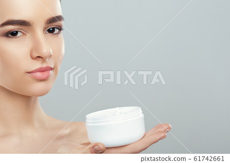 Beautiful Young Woman with Clean Fresh Skin look 61742661