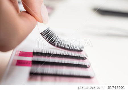 Eyelash Extension tools on white background. Accessories for eyelash extensions. Artificial lashes. Eyelash Extension tools on white background. Accessories for eyelash extensions. Artificial lashes. 61742901
