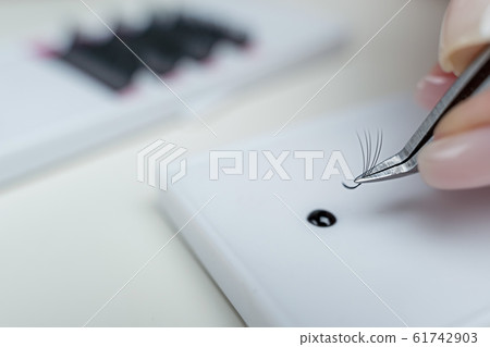 Eyelash Extension tools on white background. Accessories for eyelash extensions. Artificial lashes. Eyelash Extension tools on white background. Accessories for eyelash extensions. Artificial lashes. 61742903