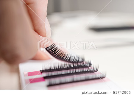Eyelash Extension tools on white background. Accessories for eyelash extensions. Artificial lashes. Eyelash Extension tools on white background. Accessories for eyelash extensions. Artificial lashes. 61742905