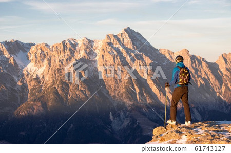 Lonely person portrait and Mountain Birnhorn Saalbach sunset view in the valley Lonely person portrait and Mountain Birnhorn Saalbach sunset view in the valley 61743127