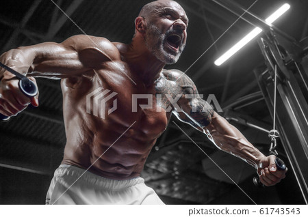 Handsome athletic men pumping up muscles push-ups 61743543