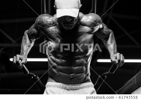 Handsome athletic men pumping up muscles push-ups 61743558