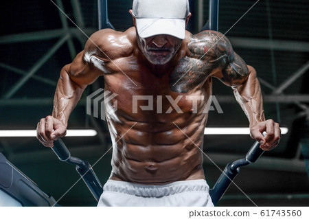 Handsome athletic men pumping up muscles push-ups 61743560