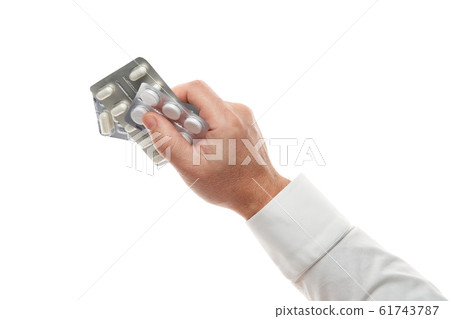 Man hand with pills blister isolated on white 61743787