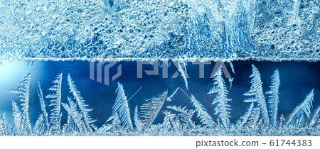 Frosty pattern on transparent background. Background light blue winter. Blue backdrop beautiful abstract background. Cold weather Banner 61744383