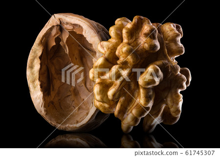 Set of walnuts isolated on a black background Set of walnuts isolated on a black background 61745307