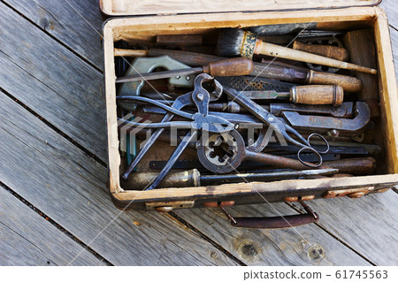 The metal tools in the old suitcase The metal tools in the old suitcase 61745563