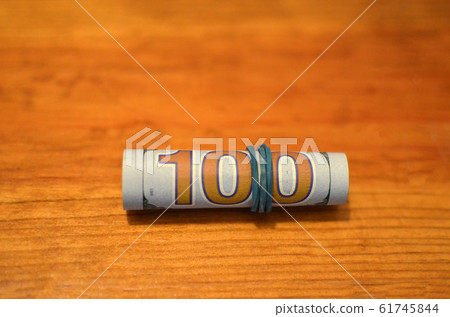 Stack of money dollars bounded by rubber. 61745844