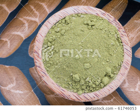 Henna powder in the coconut bowl 61746053