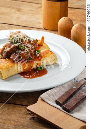 Close up view of thin pancakes stuffed with beef Close up view of thin pancakes stuffed with beef 61746066