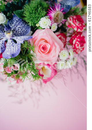 stylish trendy delicate bouquet with a variety of spring flowers, roses, orchids in a round box on a 61746883