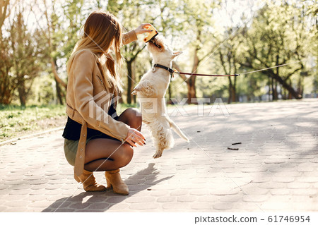 Elegant little girl in a spring park Elegant little girl in a spring park 61746954