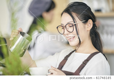 Cafe shop clerk woman Cafe shop clerk woman 61748185
