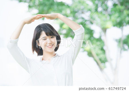 Young woman making "OK" sign 61749724