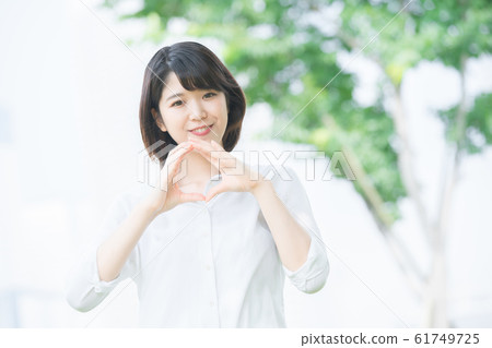 Young woman making "OK" sign Young woman making "OK" sign 61749725