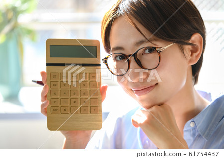 Housewife, household, tax return, calculator Housewife, household, tax return, calculator 61754437