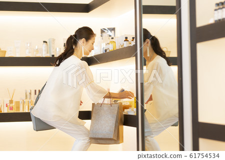Senior woman shopping at a general store 61754534