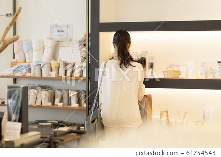 Senior woman shopping at a general store Senior woman shopping at a general store 61754543