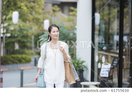 Senior woman after shopping Senior woman after shopping 61755630