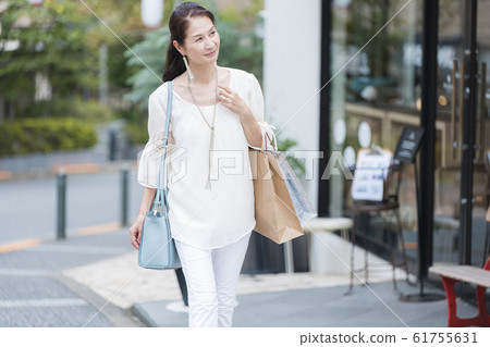 Senior woman after shopping Senior woman after shopping 61755631