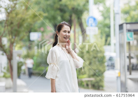 Senior woman after shopping 61755964