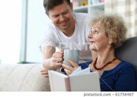 Son caring of aged mother Son caring of aged mother 61756467