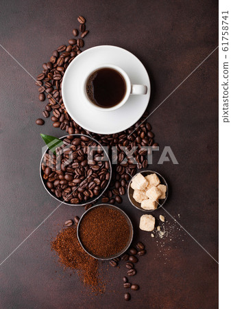 White cup of fresh raw organic coffee with beans 61758741