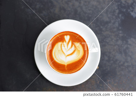 Coffee in white cup on grunge metal table Coffee in white cup on grunge metal table 61760441