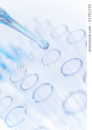 Close up of drops blue chemical substance into test tube in clean laboratory 61761150