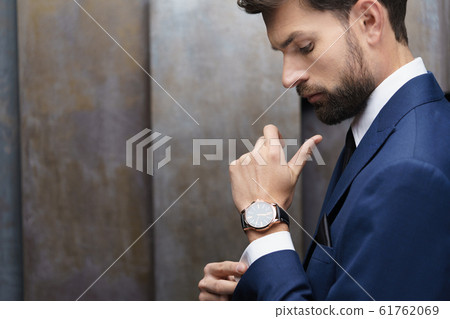 indoor photo of young handsome stylish businessman wearing suit 61762069