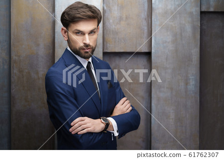 indoor photo of young handsome stylish businessman wearing suit 61762307