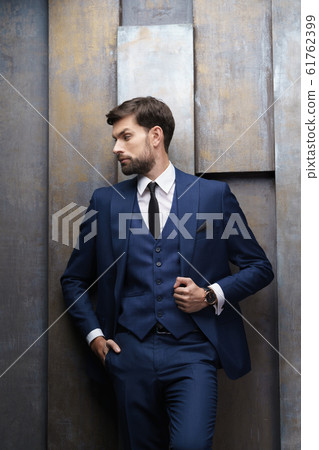 indoor photo of young handsome stylish businessman wearing suit 61762399