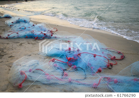 Close view of some blue fishing net floaters on 61766290