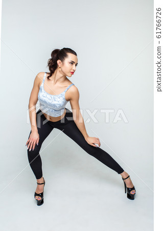 Beautiful and slender dancer girl in high heels 61766726