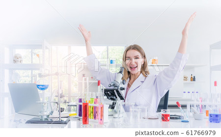 pretty scientist work reserching and cheerfully in chemical laboratory 61766979