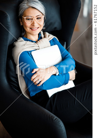 Woman enjoying the end of her working day stock photo 61767152