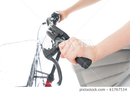 Students in uniforms going to school by bicycle Students in uniforms going to school by bicycle 61767534