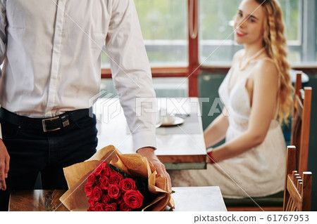 Unrecognizable Man With Flowers For Woman Unrecognizable Man With Flowers For Woman 61767953