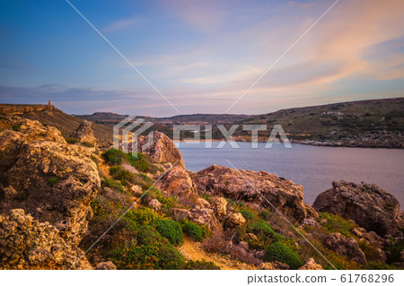 beautiful sunset and seascape view with mountains 61768296