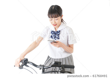 Young student using a bicycle Young student using a bicycle 61768491