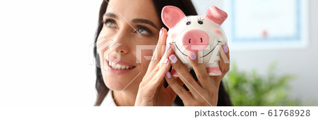 Woman and ceramic figure Woman and ceramic figure 61768928
