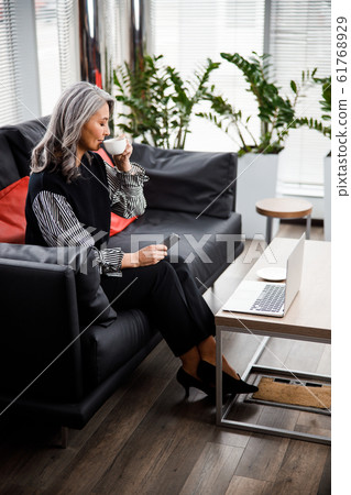 Finding time for some coffee at work stock photo Finding time for some coffee at work stock photo 61768929